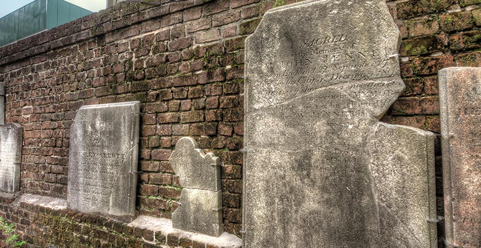 A row of tombs inside of Colonial Park Cemetery, one of Savannah's historic cemeteries.